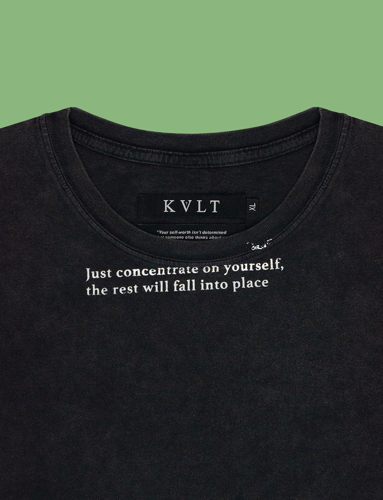 Close-up of the CONCENTRATE Tee in Sun-Bleached Black by KULT Clothing | eco-friendly, climate neutral t-shirt | "Just concentrate on yourself, the rest will fall into place"