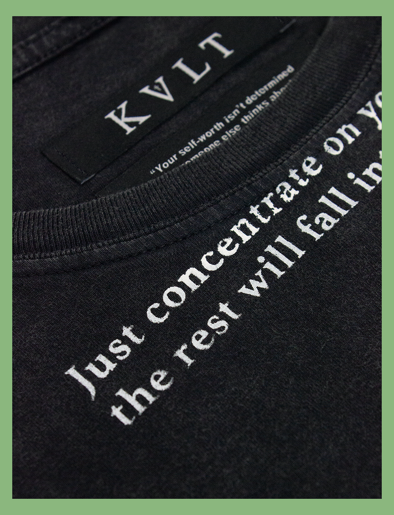 Details of the distressed print on the CONCENTRATE Tee in Sun-Bleached Black by KULT Clothing | eco-friendly, climate neutral t-shirt | Just concentrate on yourself, the rest will fall into place