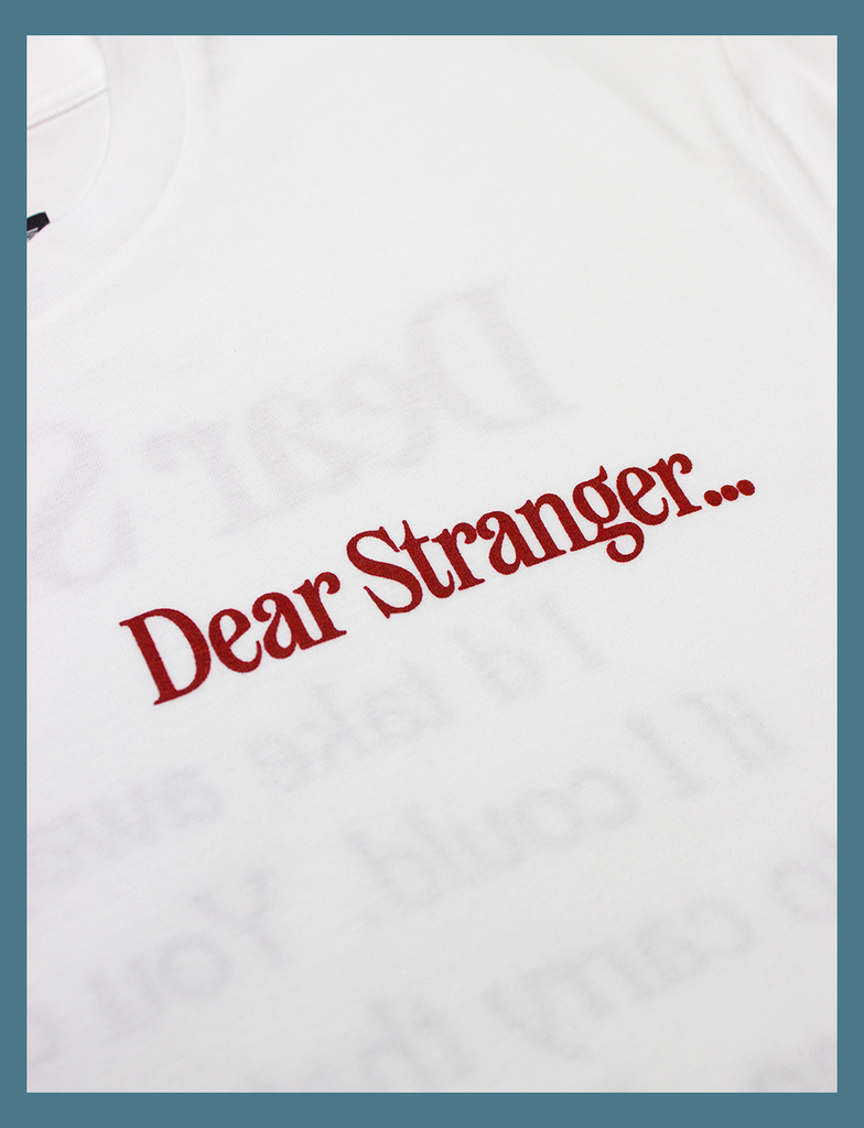 Second close-up view of the hand-printed design on the DEAR STRANGER Tee by KULT Clothing | It reads "Dear Stranger..." | Hand-printed using eco friendly inks