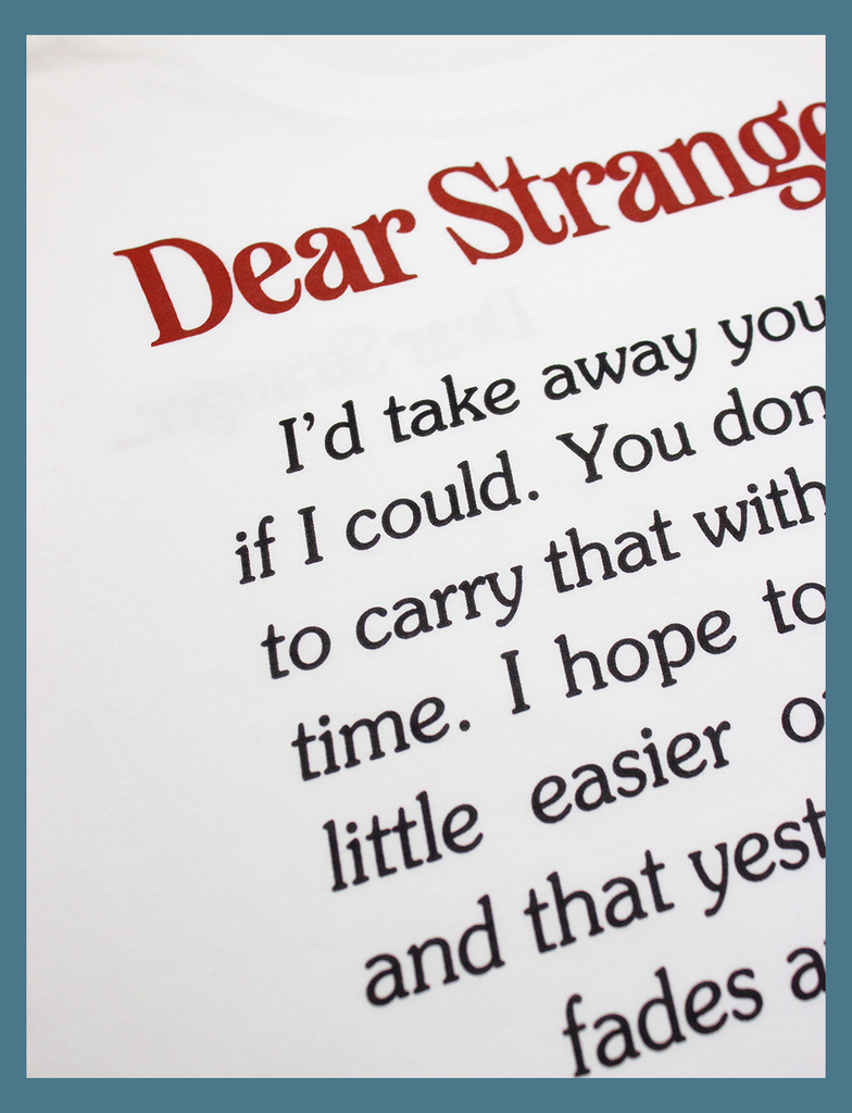 Close-up view of the rear hand-printed design on the DEAR STRANGER Tee by KULT Clothing | Hand-printed using eco friendly inks