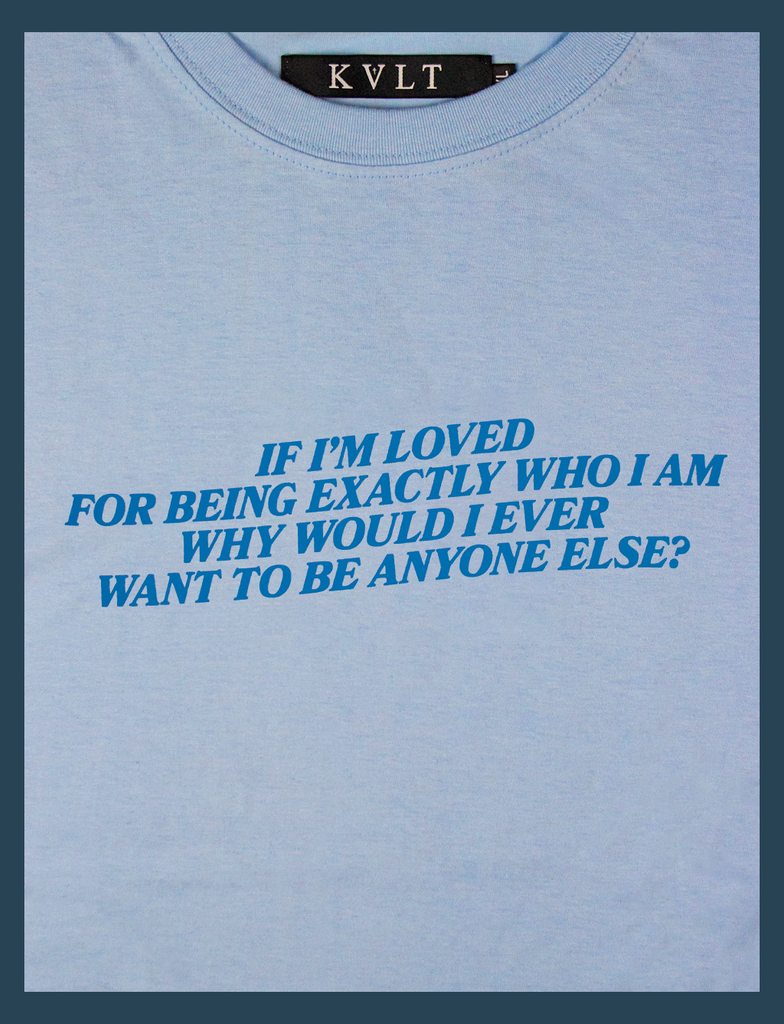 A detailed close-up of the neckline and hand-printed design on the LOVED Tee in Light Blue by KULT Clothing | The design reads "If I'm loved for being exactly who I am why would I ever want to be anyone else?" | Printed by hand in the UK using our Barely There™ vinyl | KULT