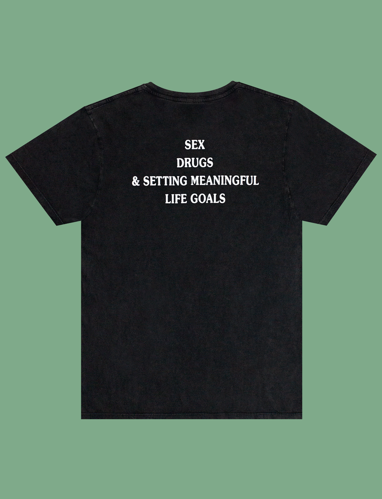 Reverse view of the print on the MEANINGFUL GOALS Tee in Sun-Bleached Black by KULT Clothing | Sex, Drugs, & Setting Meaningful Life Goals | Ethical t-shirt manufactured solely using renewable energy from wind and solar power
