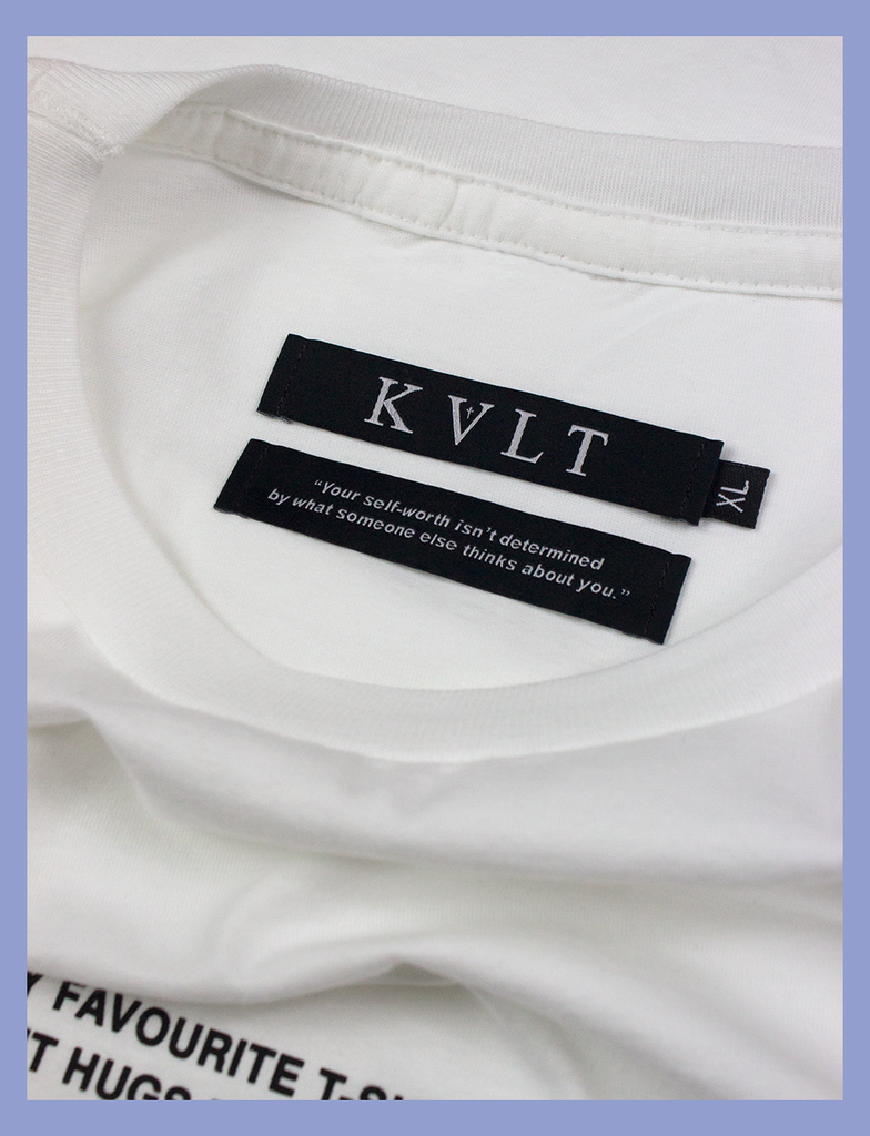 A shot of the self-worth twin labels inside the neckline of the MY FAVOURITE Tee by KULT Clothing | KVLT - "Your self-worth isn't determined by what someone else thinks about you." | ethical t-shirt manufactured solely using renewable energy from wind and solar power