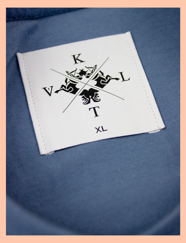 Close-up view of the woven neck label on the 3 A.M. Tee in Cobalt Blue by KULT Clothing | You are my 3 a.m. thought and my Sunday afternoon smile | KVLT