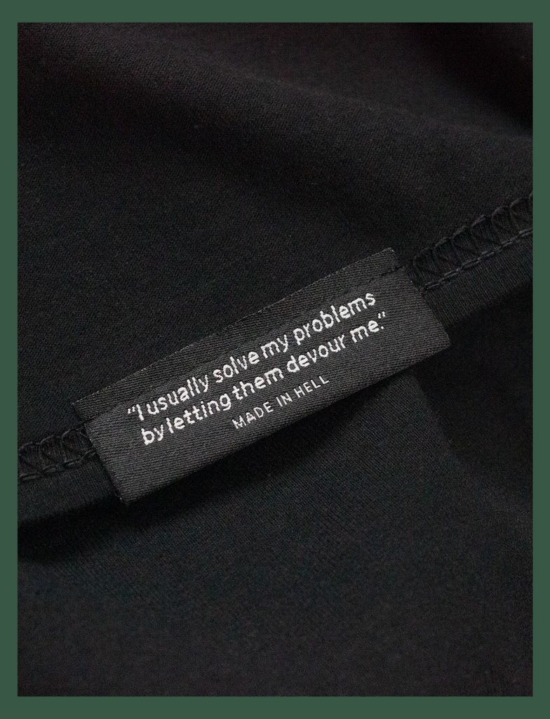 Close-up of the reverse on the woven hem label on the BLACK MINDS MATTER Charity Tee in Black by KULT Clothing | Please don't hesitate to love me. KULT