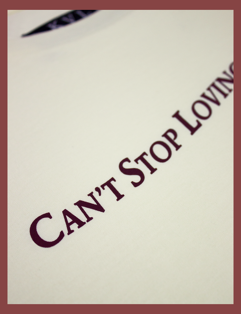 Second close-up view of the hand-printed design on the CAN'T STOP LOVING YOU CLUB Tee by KULT Clothing | It reads "Can't Stop Loving You Club" next to an illustration of a cherub holding a skull | Hand-printed using eco friendly inks