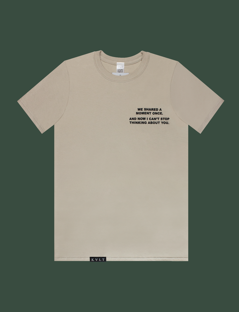 Front view of the DISTANT LOVE Tee in Sandstone by KULT Clothing | I love it when you miss me. I love when I can feel you hugging me when you aren’t even nearby. You’re like a clothing label brushing against the back of my neck, reminding me I’m loved. KULT