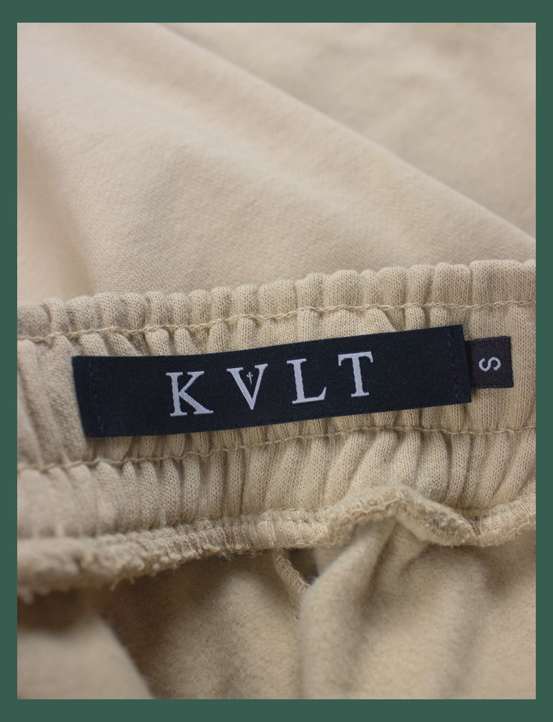 Close-up shot of the KULT sizing label on the inside waistband of the EMBRACE Sweatpants in Rodeo by KULT Clothing | KVLT
