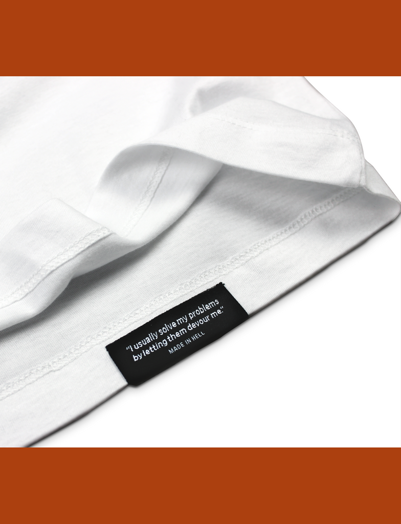 Close-up of the internal hem branding on the BASIK Tee in White