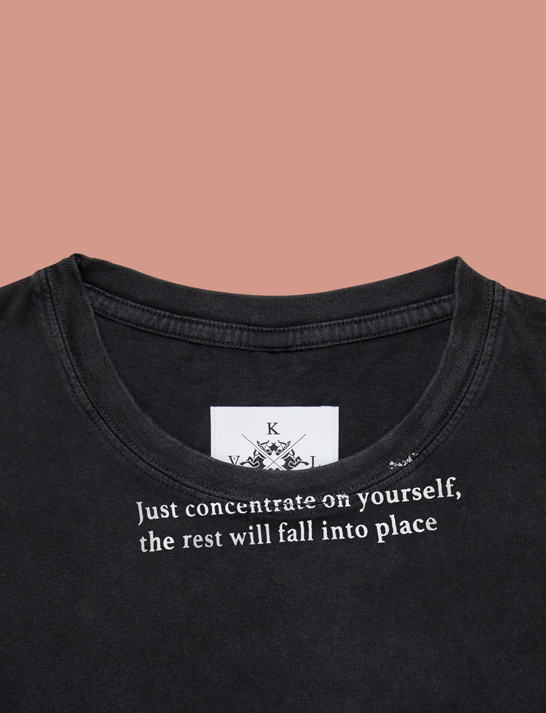 Close-up of the CONCENTRATE Tee in Sun-Bleached Black by KULT Clothing | eco-friendly, climate neutral t-shirt | Just concentrate on yourself, the rest will fall into place