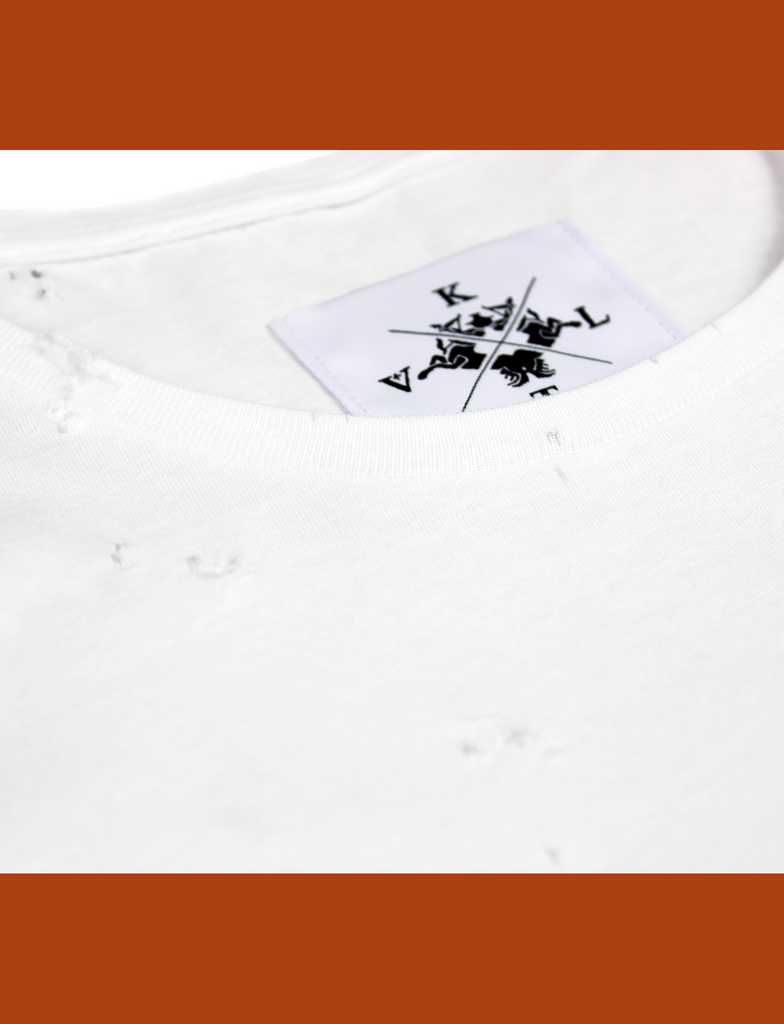 Close-up of the internal neck branding on the DISTRESSED BASIK Tee in White