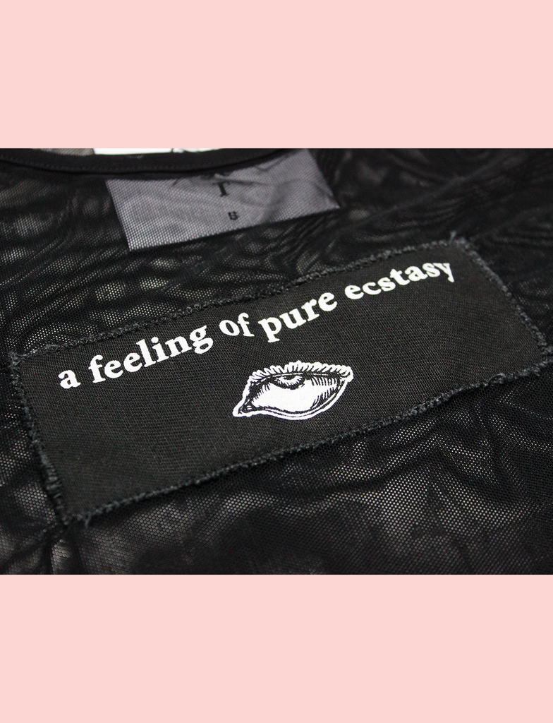 Close-up of the ECSTASY Top by KULT Clothing | Hand-printed cotton patch appliqué