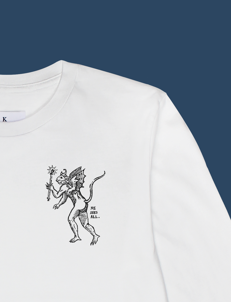 Close-up view of the breast print on the HEAVEN'S ABOVE Longsleeve Tee in White by KULT Clothing | Oh Lord, let me feel love but never know its pain