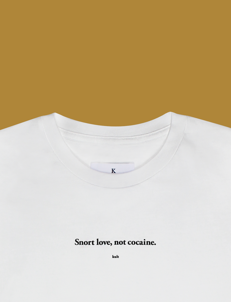 Close-up of the THE LOVE DRUG Tee in White by KULT Clothing | Snort love, not cocaine.