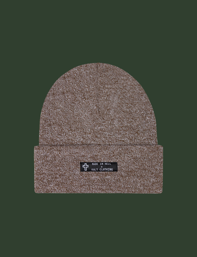 Front of the MADE IN HELL Beanie in Oatmeal by KULT Clothing | Black appliqué label on the front of a oatmeal-coloured, 100% acrylic knit beanie hat