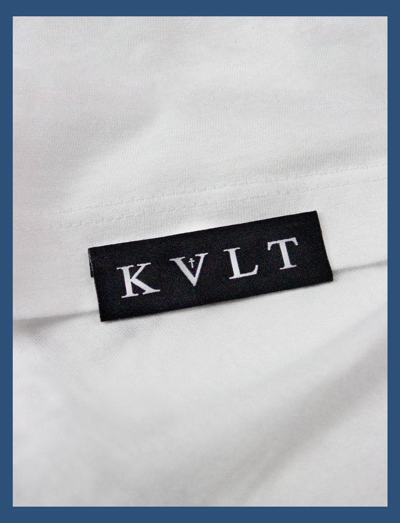 Close-up detailing of the topside hem label on the SATAN'S TONGUE Tee in White by KULT Clothing | Jesus saves... but Satan does that thing with his tongue | KVLT