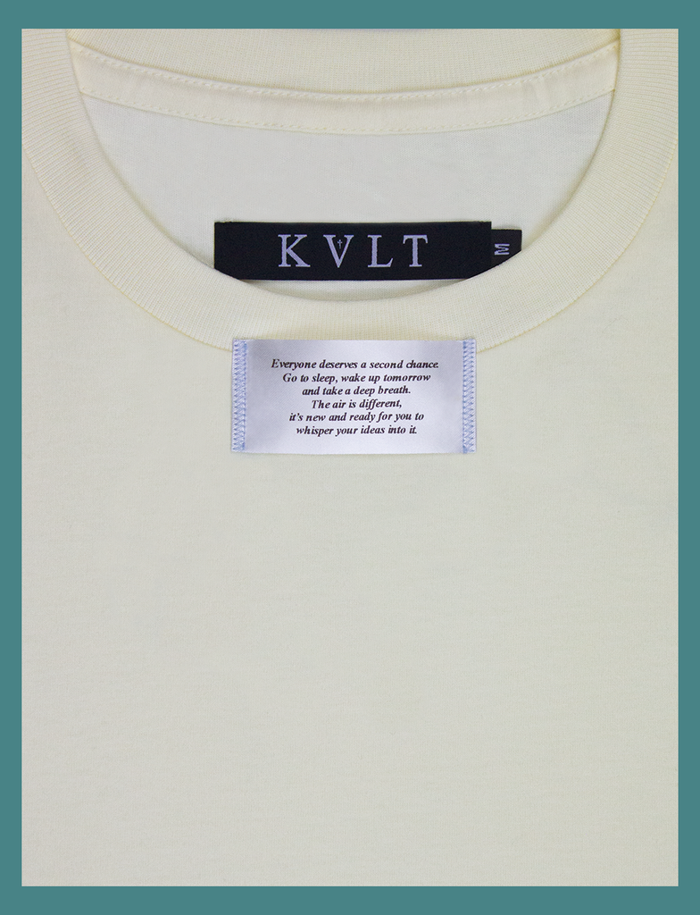 Second close-up view of the appliqué label attached at the neckline on the SECOND CHANCE Tee by KULT Clothing | It reads "Everyone deserves a second chance. Go to sleep, wake up tomorrow and take a deep breath. The air is different, it's new and ready for you to whisper your ideas into it" | HD printed premium heavyweight satin label