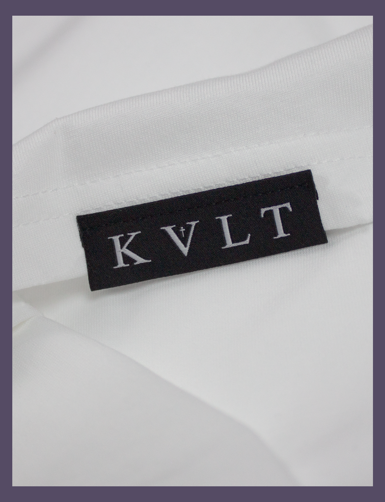 Close-up of the top side hem label on the SOCIAL DISTANC Tee by KULT Clothing | "It was just as I found myself that I lost you to the darkness." Made In Hell