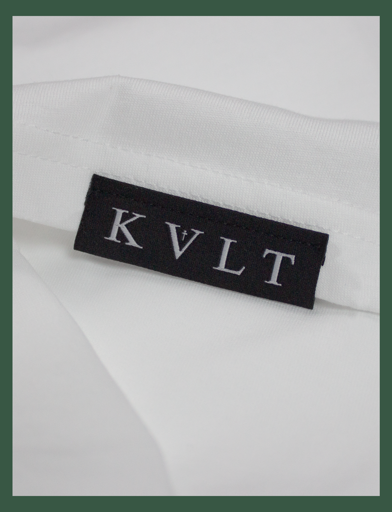 Close-up of the top side hem label on the SOCIAL DISTANCING Tee by KULT Clothing | "It was just as I found myself that I lost you to the darkness." Made In Hell