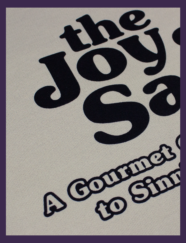 Close-up on the print on THE JOY OF SATAN Sweater in Sandstone by KULT Clothing | The Joy of Satan | A Gourmet Guide to Sinning | KULT