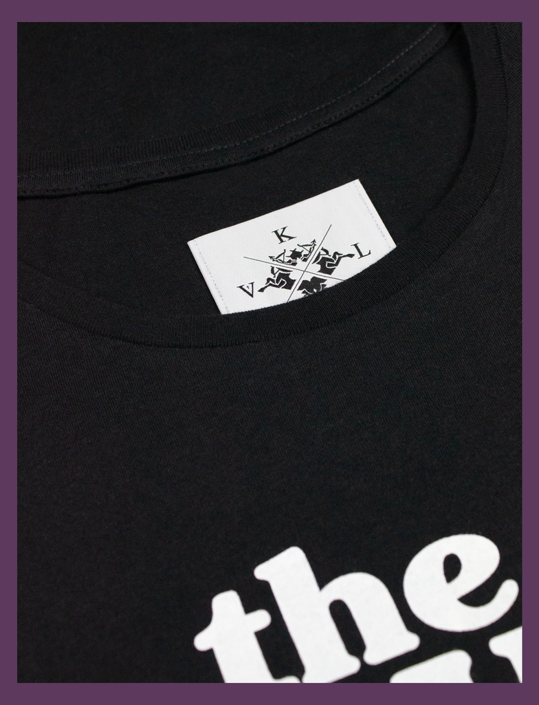 Close-up detail of the neck label on THE JOY OF SATAN Tee in Black by KULT Clothing | The Joy of Satan | A Gourmet Guide to Sinning | KVLT