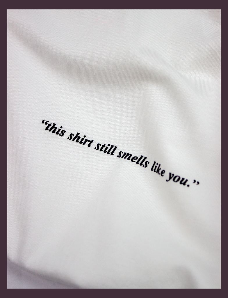Detailed view of the print on the ALWAYS WITH YOU Tee in White by KULT Clothing | Screen printed by hand in black using eco friendly inks | "This shirt still smells like you."