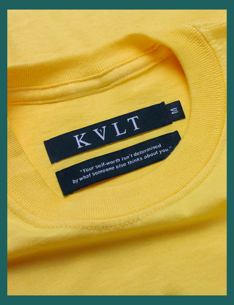 Close-up view of the twin self-worth neck labels on the GOOD DAY Tee by KULT Clothing | The bottom label reads "Your self-worth isn't determined by what someone else thinks about you." | Hand-printed using eco friendly inks