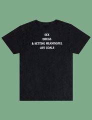 Reverse view of the print on the MEANINGFUL GOALS Tee in Sun-Bleached Black by KULT Clothing | Sex, Drugs, & Setting Meaningful Life Goals | Ethical t-shirt manufactured solely using renewable energy from wind and solar power