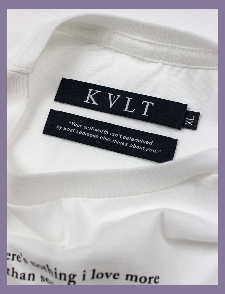 A shot of the self-worth twin labels inside the neckline of the SMILE Tee by KULT Clothing | KVLT - "Your self-worth isn't determined by what someone else thinks about you." | ethical t-shirt manufactured solely using renewable energy from wind and solar power