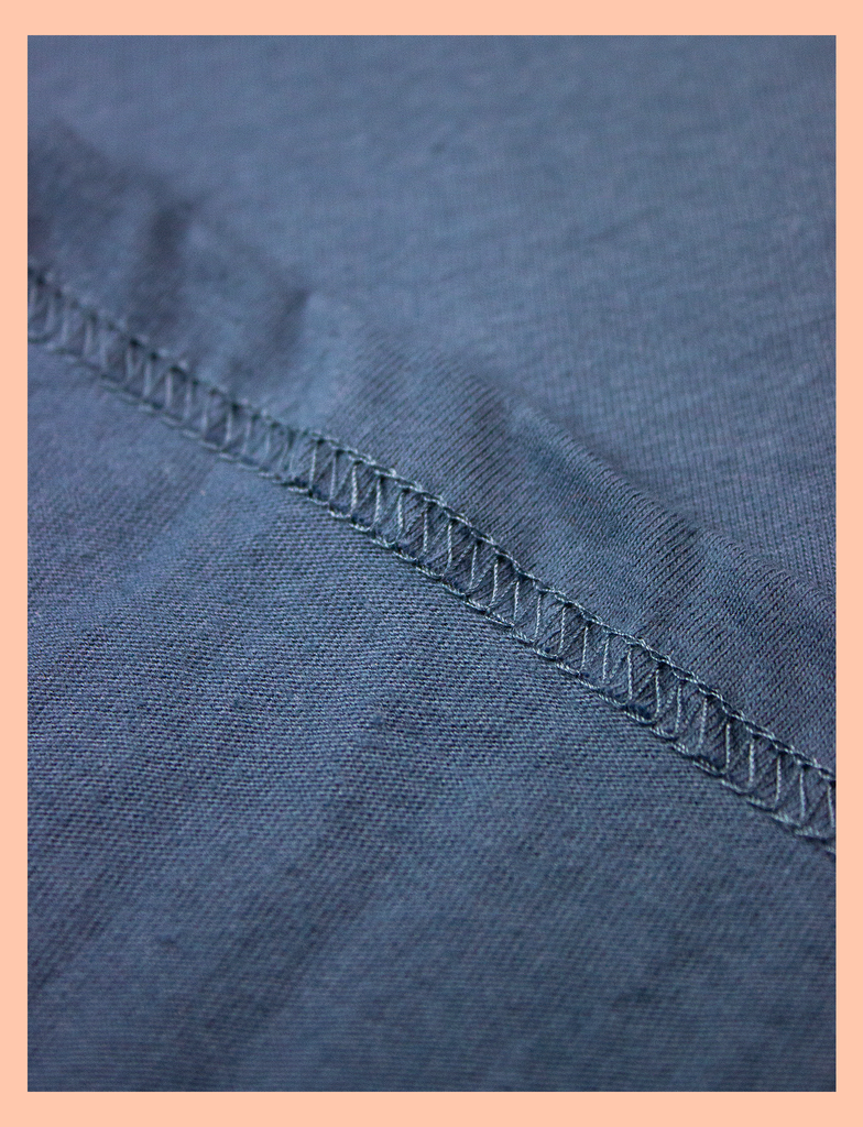 Close-up view of the twin-stitched hem on the 3 A.M. Tee in Cobalt Blue by KULT Clothing | You are my 3 a.m. thought and my Sunday afternoon smile | Eco-friendly inks and ethical production