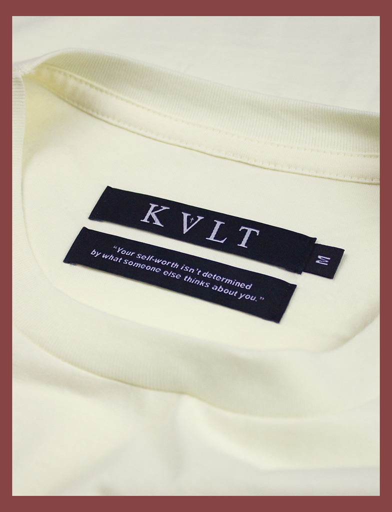 Close-up shot of the dual labels on the inside neckline on CAN'T STOP LOVING YOU CLUB Tee in Primrose by KULT Clothing | KVLT | "Your self-worth isn't determined by what someone else thinks about you."