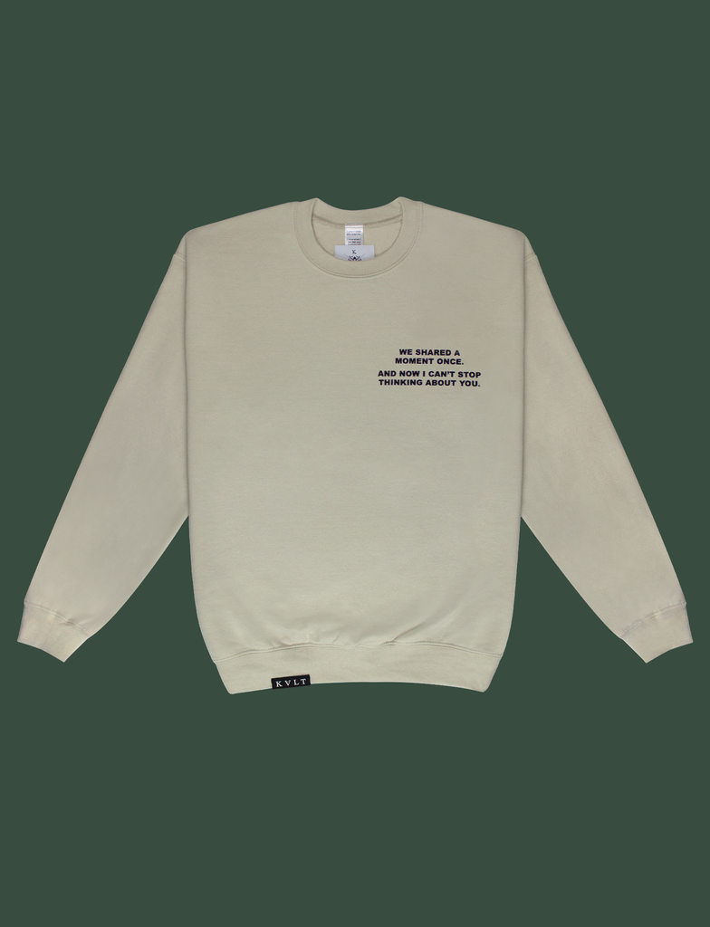 Front view of the DISTANT LOVE Sweater in Sandstone by KULT Clothing | I love it when you miss me. I love when I can feel you hugging me when you aren’t even nearby. You’re like a clothing label brushing against the back of my neck, reminding me I’m loved. KULT