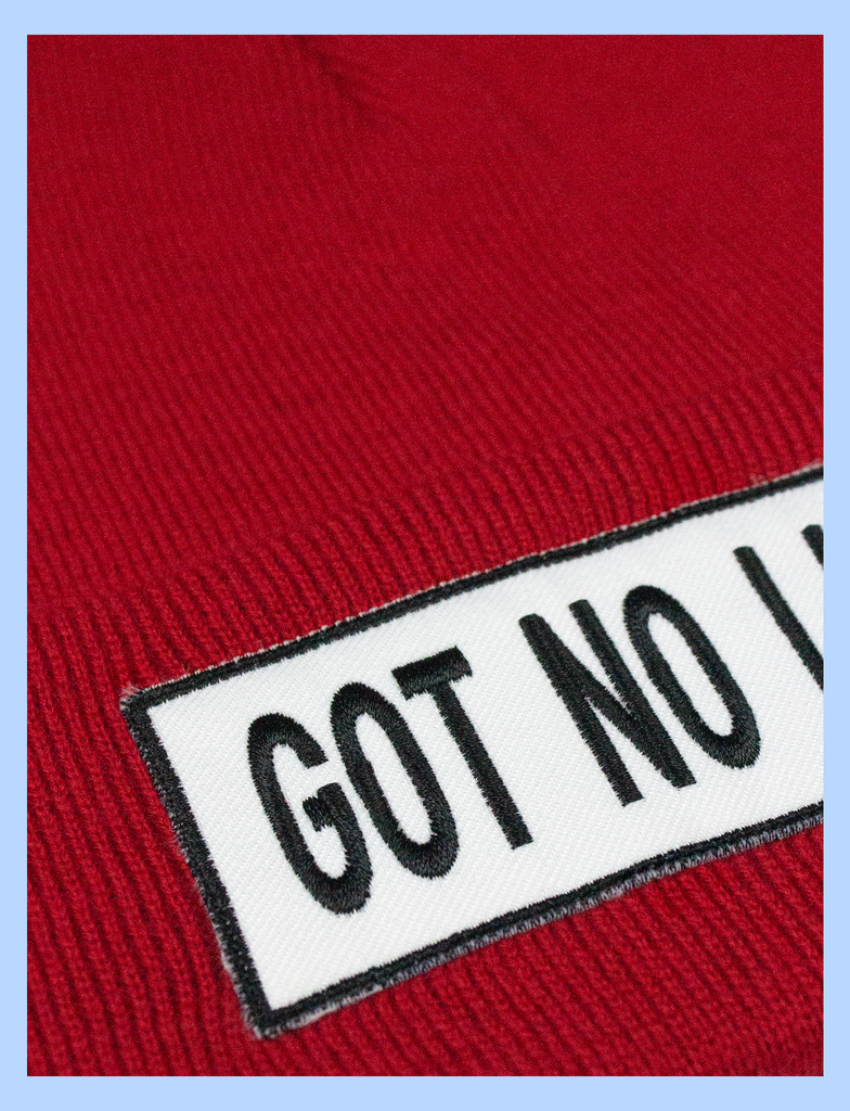 Close-up of the GOT NO LIFEY Beanie in Crimson by KULT Clothing | Appliqué patch beanie