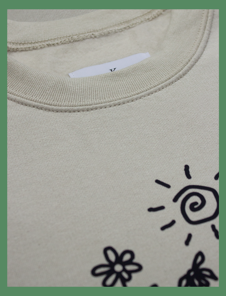 Close-up on the neck label of the GROWTH Sweater in Sandstone by KULT Clothing | KULT | KVLT