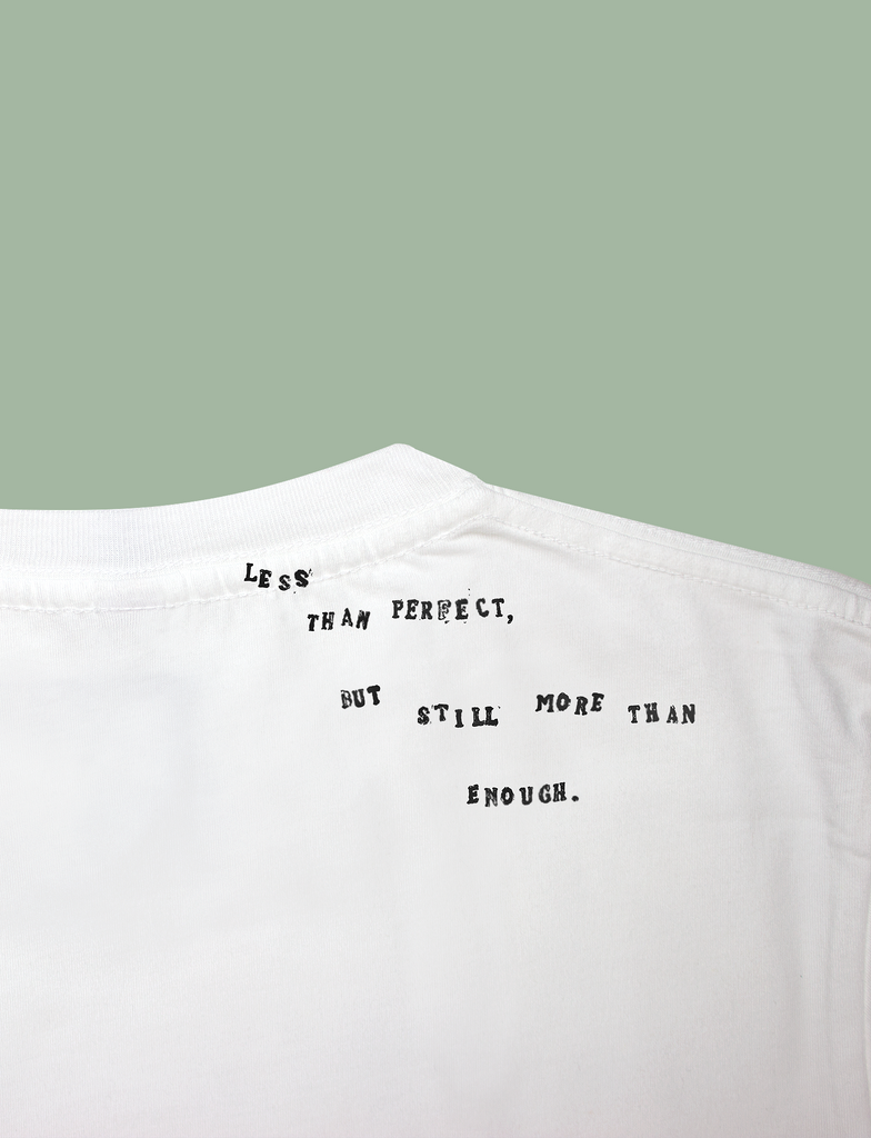 Reverse view of the I'M ENOUGH Tee in White by KULT Clothing | Less than perfect but still more than enough.