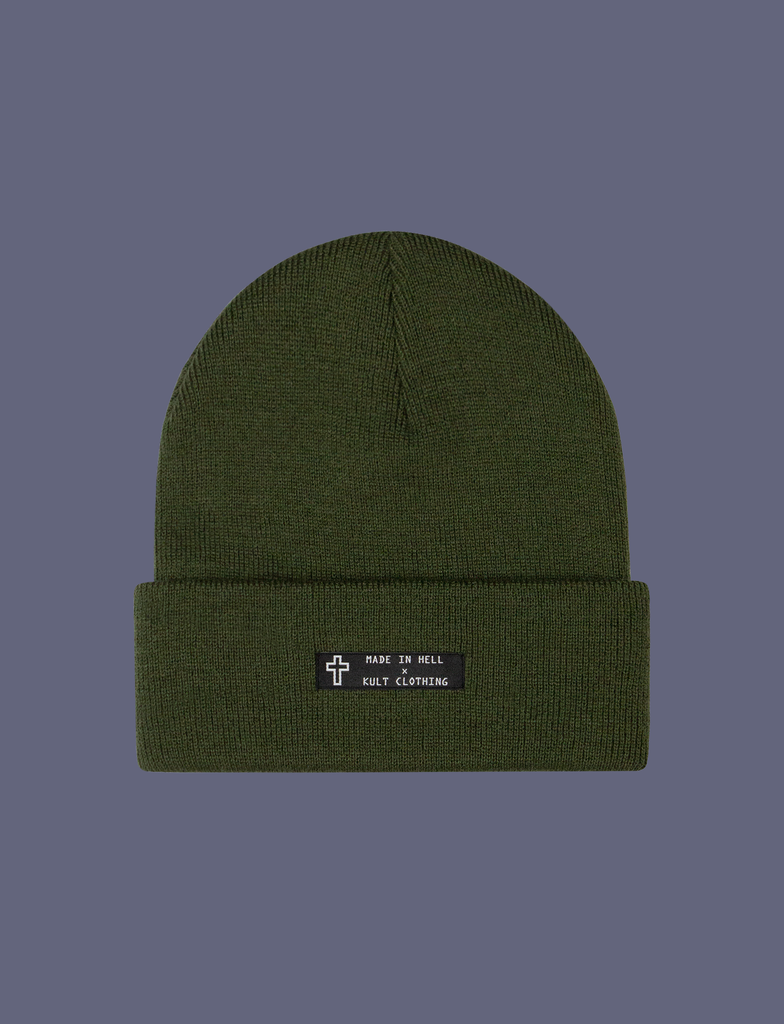 Front of the MADE IN HELL Beanie in Forest Green by KULT Clothing | Black appliqué label on the front of a forest green, 100% acrylic knit beanie hat
