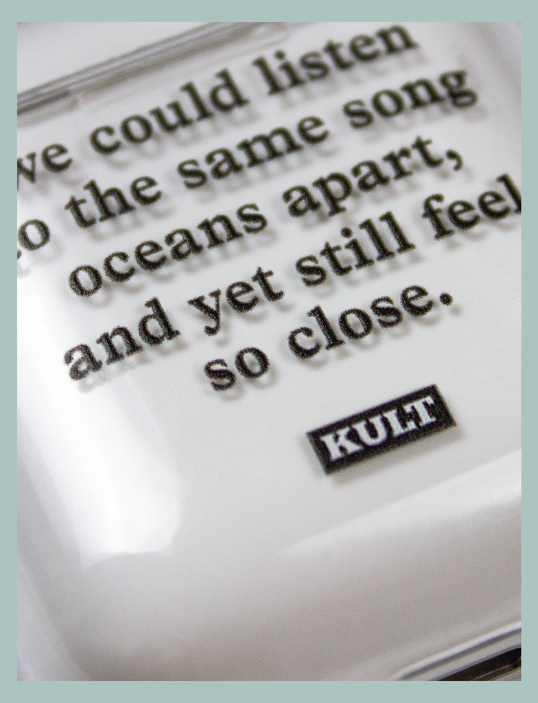 Close-up view of the UV print on the OCEANS APART AirPods Case by KULT Clothing | We could listen to the same song oceans apart, and yet still feel so close. KULT