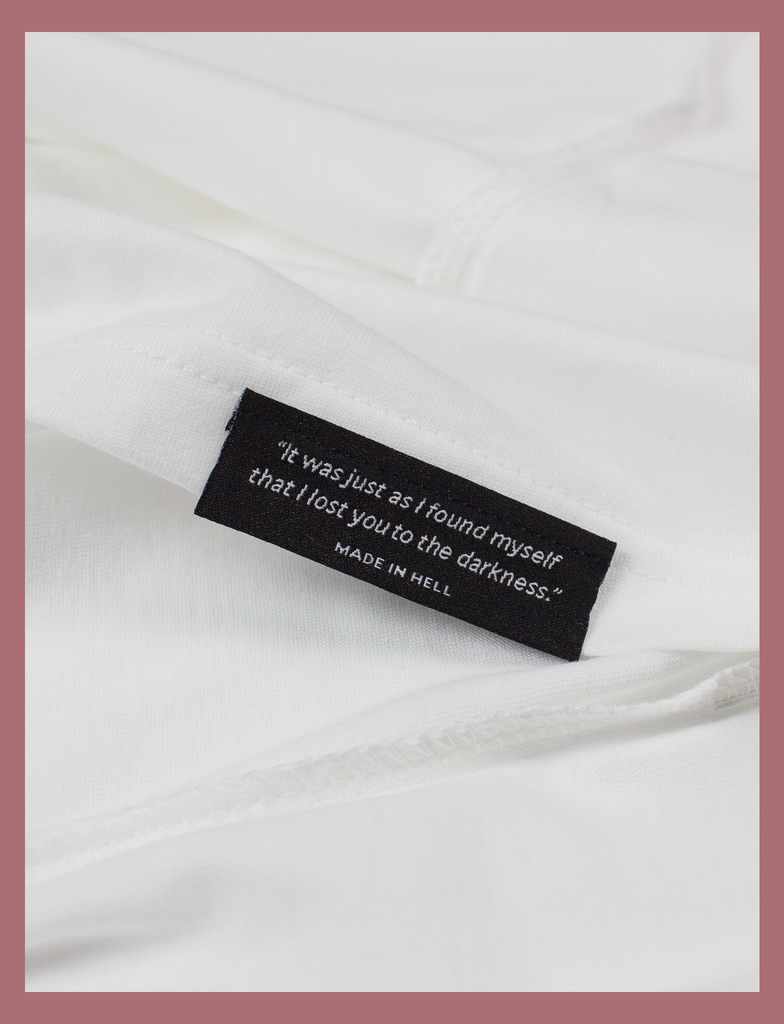 Close-up view of the underside hem label on the SUNSHINE Tee by KULT Clothing | Sunshine on my skin, I feel me again.
